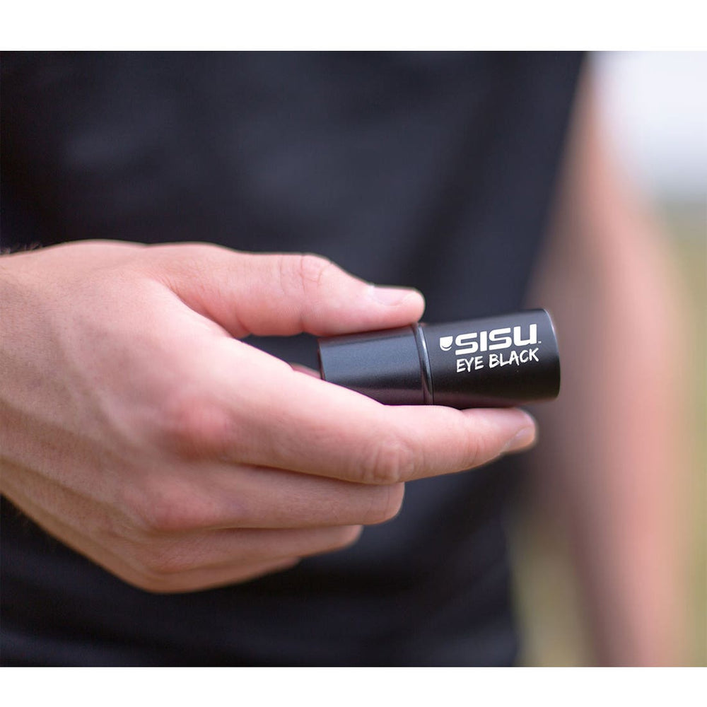athlete holding SISU eye black