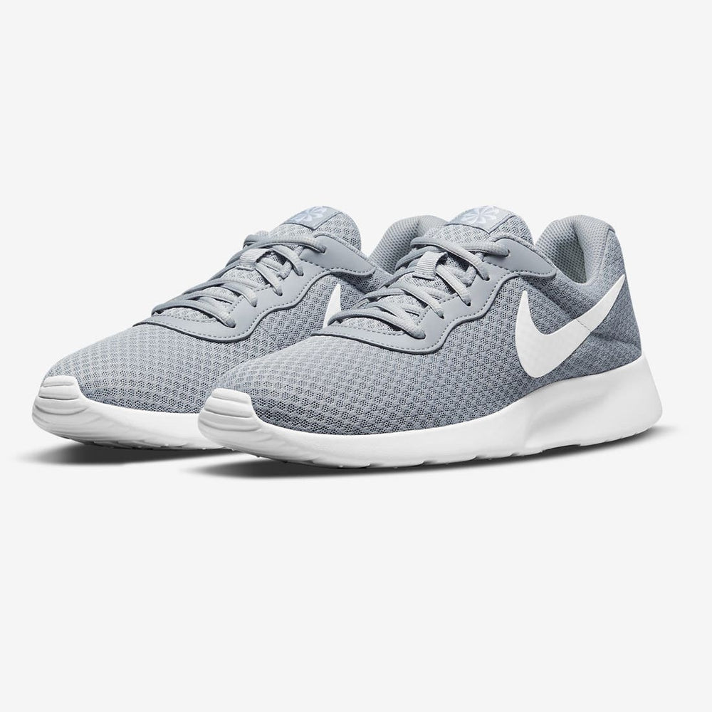 Nike Tanjun grey training shoe both shoes