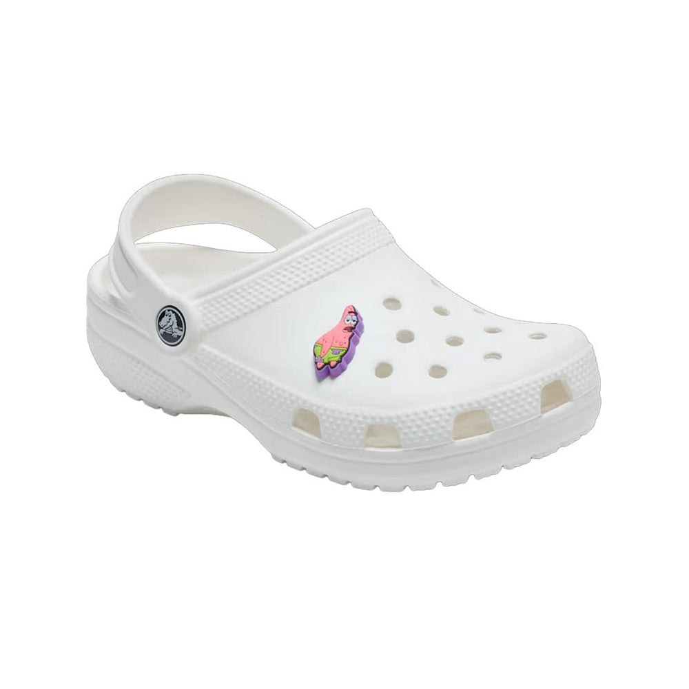 frontal view of Patrick the Star from Spongebob Squarepants on a croc shoe. Pink starish wearing green and purple bathing suit bottoms