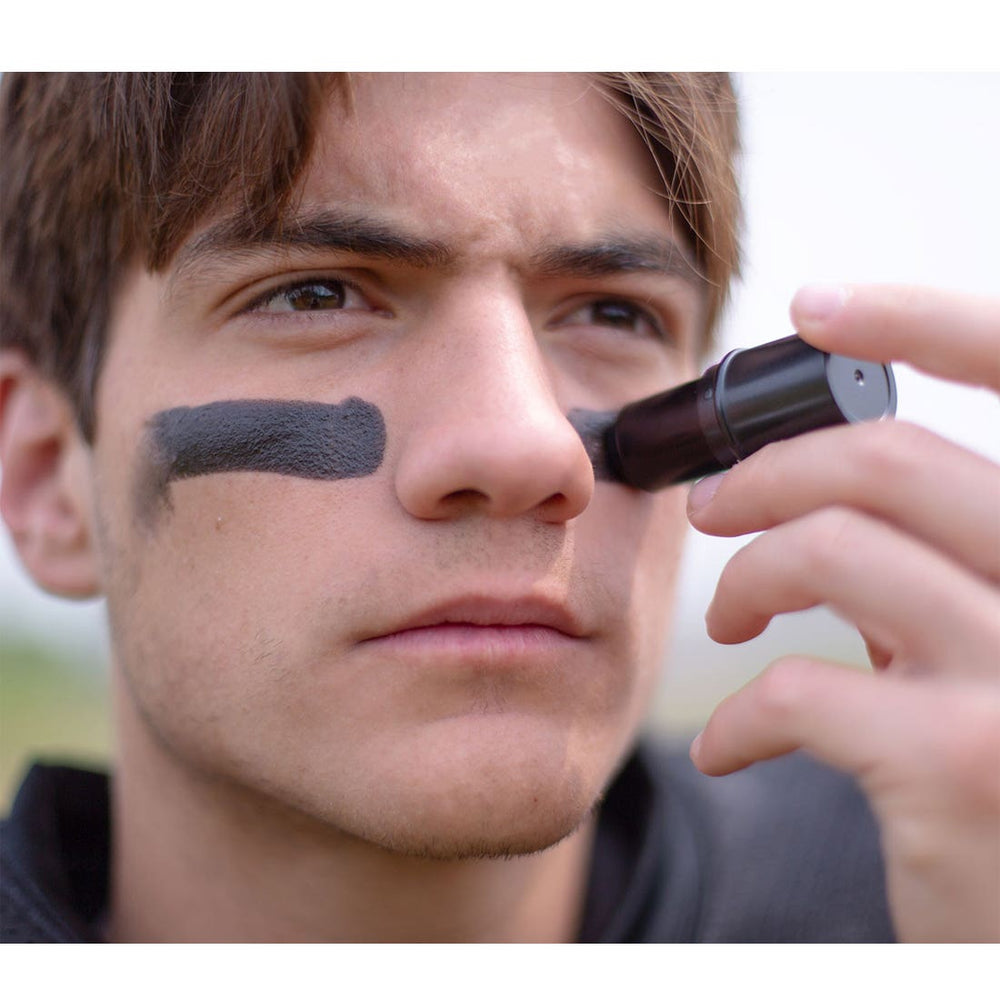 athlete applying SISU eye black
