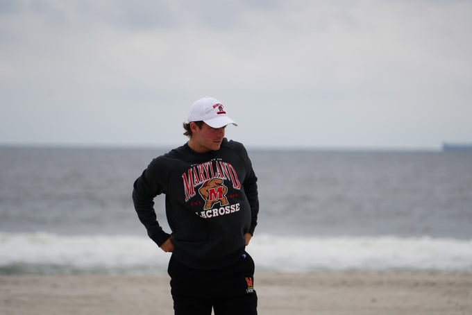 Maryland Lacrosse Crew neck on model at the beach
