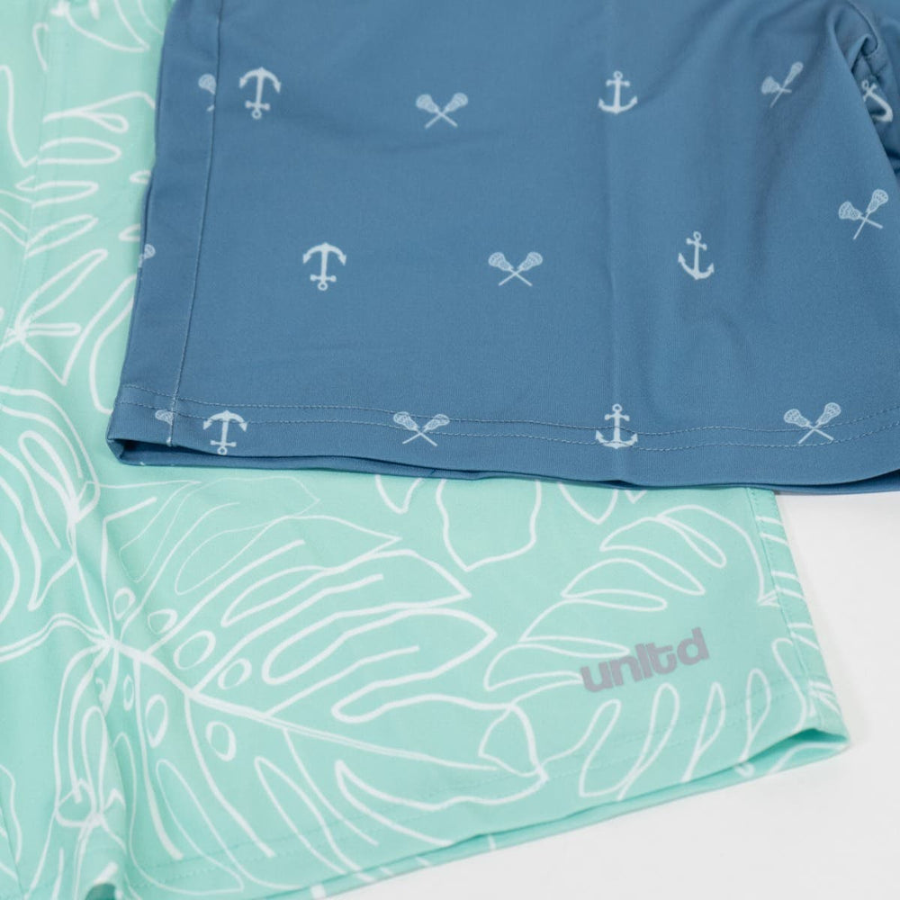 Tonal Anchors Tactical 3.0 Youth lacosse shorts stacked on top of the Youth mint leaf tactical short 