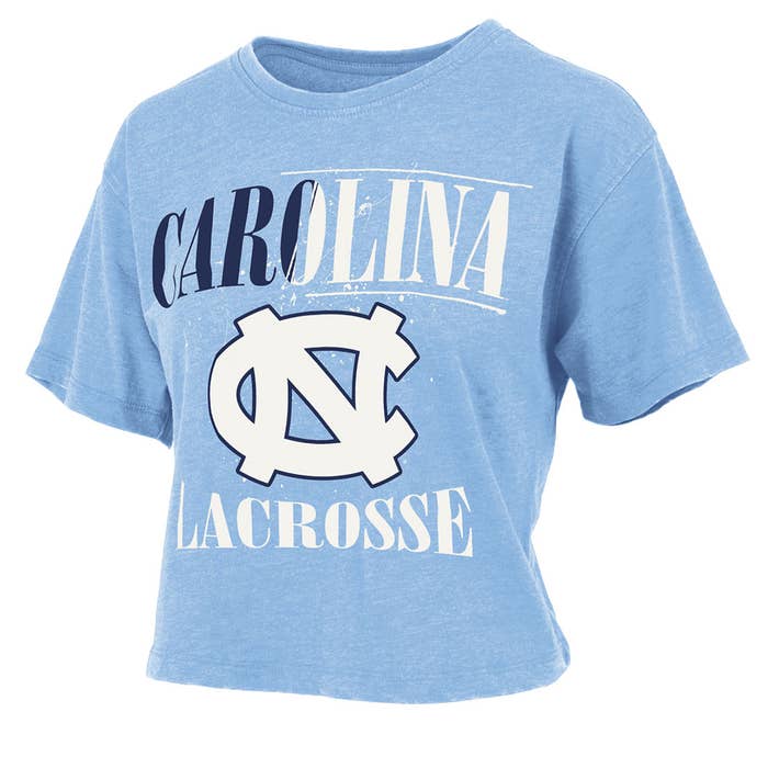 Blue Tshirt frontal view saying Carolina Lacrosse in Navy Blue & White Lettering with paint splattering Blue Tshirt frontal view saying Carolina Lacrosse in Navy Blue & White Lettering with paint splattering