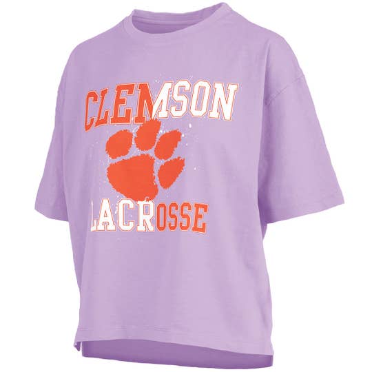 purple tshirt frontal view saying "Clemson Lacrosse" in orange and white letters with tiger paw print