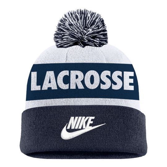 Frontal view Nike with swoosh embroieded, "Lacrosse" above. Top has a pom pom
