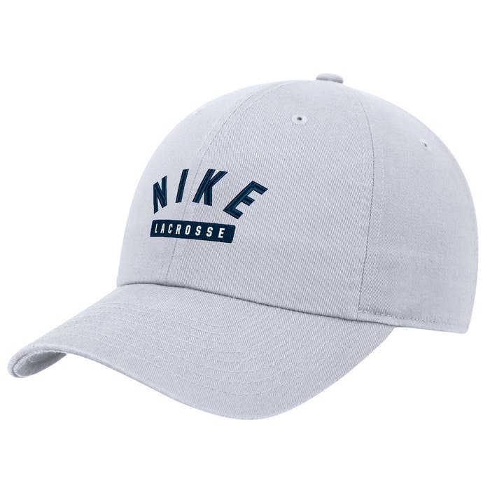 Frontal view mid-depth  nike hat. Says Nike Lacrosse embroided in middle. precurved bill